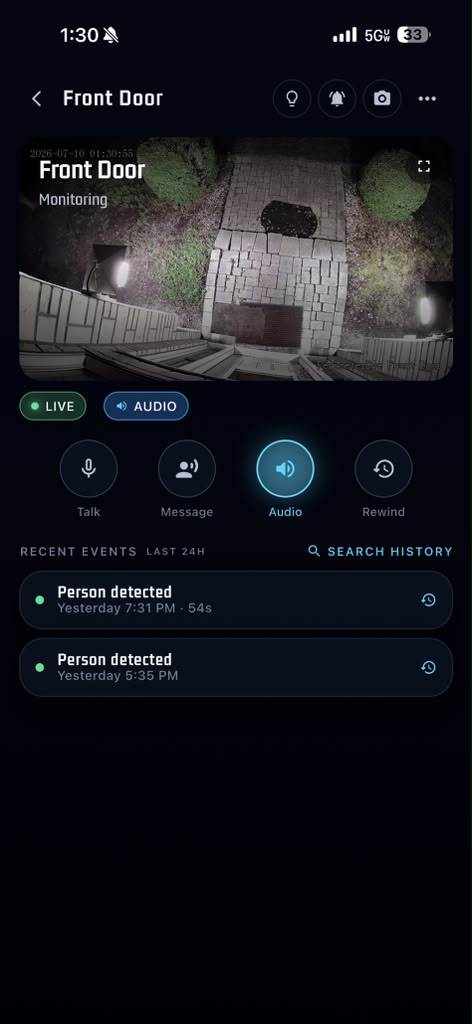 PerimeterEye iOS app camera view of the front door at night with live audio, talk, message, and instant rewind controls, and recent AI-reviewed person detection events
