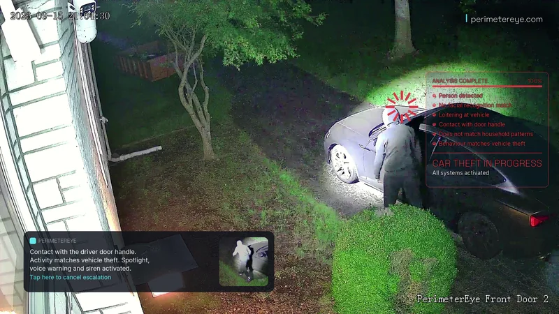 The searchlight lighting the person at the driver’s door, with car theft in progress on the analysis panel
